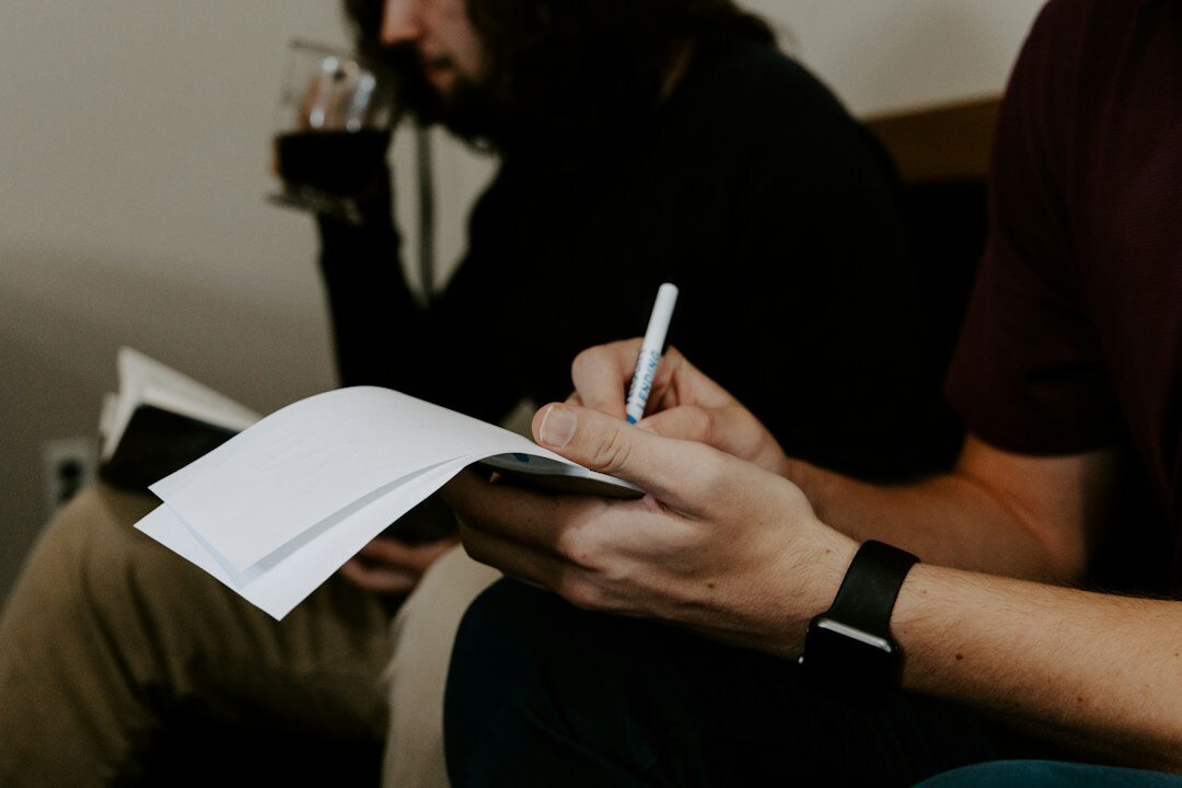 people filling out survey forms