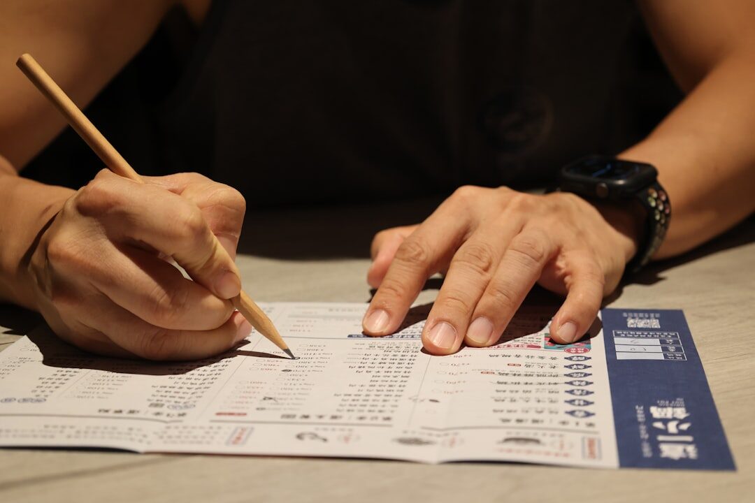 Person filling out a paper survey questionnaire